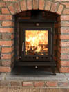 ekol crystal 8kW fitted in brick fireplace