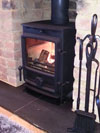 Limestone hearth and FDC 5kW stove in Brighton