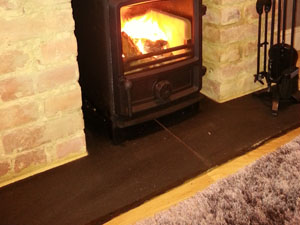 Khota black limestone hearth by HOVE WOOD BURNERS