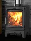 Saltfire Peanut 5kW with logstore in Cabin